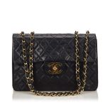 A Chanel classic maxi lambskin flap bag, the classic maxi flap features a quilted body, an