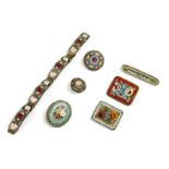 Seven micro mosaic pieces, to include two circular micro mosaic brooches with floral centres, two