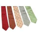 Five Loewe silk ties, to include an orange ground tie with spot design, a pink ground tie with black