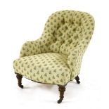 A Victorian nursing chair, with modern upholstery, on turned front legsProvenance: The Collection of