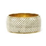 A Dolce and Gabbana snakeskin bangle, cream with dyed black scale pattern, gold-tone interior