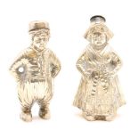 A German silver novelty salt and pepper, in the form of a Dutch boy and girl, 800 mark to base, 7.