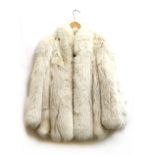A silver fox fur jacket, lined in cream silk, with Made in England label