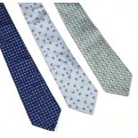 Three Loewe silk ties, comprising three blue examples, one with a pink floral design, one with a