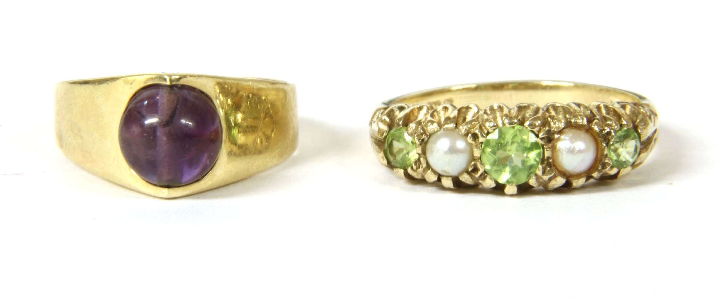 A French gold single stone amethyst bead ring, marked 585, size H, 3.40g, and a 9ct gold peridot and