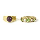 A French gold single stone amethyst bead ring, marked 585, size H, 3.40g, and a 9ct gold peridot and
