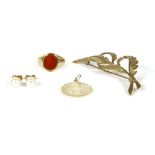 A collection of gold items, to include a 9ct gold fern spray brooch, 4.88g, a gold New York pendant,