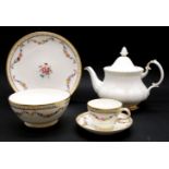A tea set, with floral garlands and gilt borders, pattern number 5089, also to include a royal