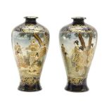 A pair of late 19th century Japanese satsuma vases, painted as figures in a garden, one signed,