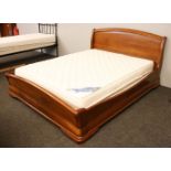 A modern cherrywood double bed, 220cm long, 172cm wide, 97cm high