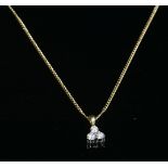 An 18ct gold trefoil cluster diamond pendant, by Fred E Ullman, with three brilliant cut diamonds,