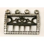 A sterling silver Georgian hinged buckle, set with white paste stones