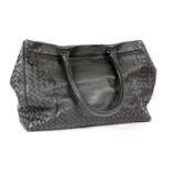 A Bottega Veneta black leather Nappa Intrecciato Veneta handbag, with zip pocket and dual rolled