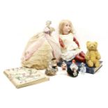 A collection of porcelain dolls, two teddies, and two further dolls