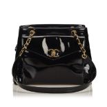 A Chanel Patent Leather Chain Shoulder Bag, featuring a patent leather body, flat straps with gold-