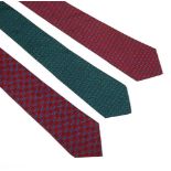 Three Hermès silk ties, to include a navy silk ground tie with a printed green horseshoe motif, a