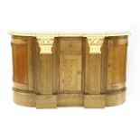 A Continental style oak parcel gilt credenza, with a central drawer over single door cupboard,