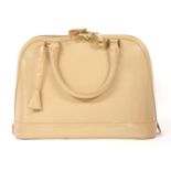 An Aspinal of London 'Hepburn' patent nude handbag, a classic design featuring zip closure, double