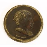 A carved oak and gilt highlighted portrait roundel of Lord Byron, mid 19th century, 13cm