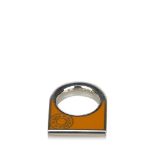 A Hermès scarf ring, with palladium hardware set with Hermès classic colour orange enamel panel,