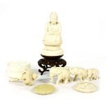 A collection of Japanese ivory, including a group of three elephants, Taisho period, a box with