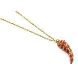 A gold-tone Roberto Cavalli 'horn of life' pendant, featuring a horn charm with red enamel base,