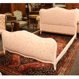 A French style white painted and pink upholstered double bed, complete with Millbrook President