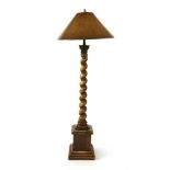 A mahogany barley twist standard lamp, on square pedestal base with a corinthian capital, 73cm high,
