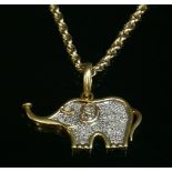 A two colour gold, diamond set, elephant pendant, with a flat section white gold centre, pavé set