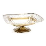 A silver dish with pierced border, raised on pedestal foot, by George Wish & Co LTd, Sheffield,