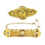 A Victorian gold single stone diamond bar brooch, with filigree decoration, marked 15, 4.85g, a