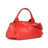 A Marc Jacobs red leather handbag, with black and white monogrammed fabric