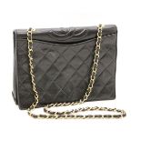 A vintage Chanel flap handbag, black calf skin leather, classic quilting to the front and back
