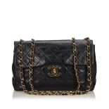 A Chanel Jumbo Classic single flap bag, featuring a lambskin leather body, a chain shoulder strap, a