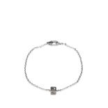 A Gucci white gold mongrammed cube bracelet, with a white gold G cube pendant and chain, marked