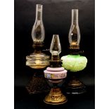 A Victorian Duplex oil lamp of column form, with white opaque glass shade, 65cm high, together