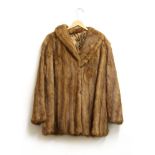 A blonde mink fur coat, and a caramel mink fur coat, both with silk lining