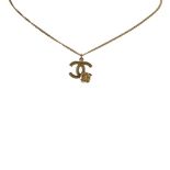 A Chanel double C and Camellia pendant necklace, featuring a double C pendant with a flower