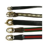Five assorted Gucci belts, to include a blue and red canvas example with double 'G' clasp, a similar