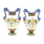 A pair of Italian pottery vases, each with entwined handles, 27cm high