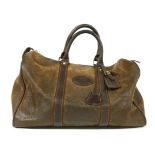 A Mulberry Country holdall, brown leather with tartan lining