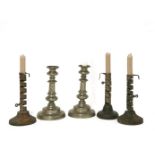 Three iron spiral ejector candlesticks, on wooden bases, 19cm high and a pair of pewter