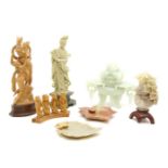 A collection of hardstone and wood carvings, to include a Chinese jade koro, a soapstone figure