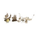 A small Chinese silver model of a junk, together wish a filligree model of a ship, a white metal