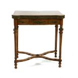 A French style walnut and kingwood crossbanded lobed card table, with brass mounts, on fluted legs