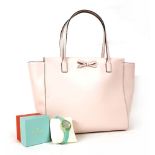 A Kate Spade of New York pink leather tote handbag, with applied pink bow, stamped lettering and