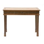 A low French walnut Gothic pier table, 19th century with a tooled leather inset over a blind fret