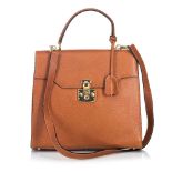A Gucci leather Kelly satchel handbag, featuring a leather body, flat leather handle, detachable