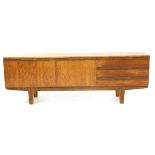 A post-war teak sideboard, with arrangement of drawers and cupboards, 204 x 45 x 73cm
