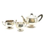 A silver three piece tea service, Walker & Hall, Sheffield, 1925, 869g